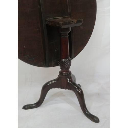 130 - Victorian mahogany round occasional table with tip-up top, ornate vase turned column, on hipped trip... 