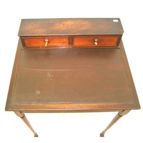 181 - William IV mahogany bonheur de jour desk with two frieze drawers, having lionmask handles, on turned... 