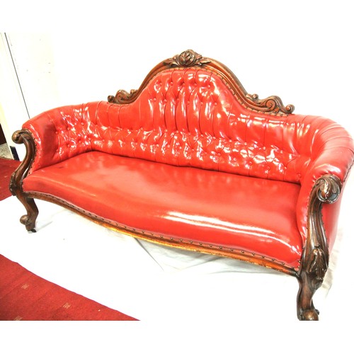 315 - Victorian design couch with scroll decoration, buttoned red leather upholstering, on cabriole legs