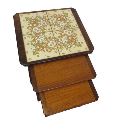 114 - Nest of 3 G-plan tables, top one with tiled insets on oblong plinths