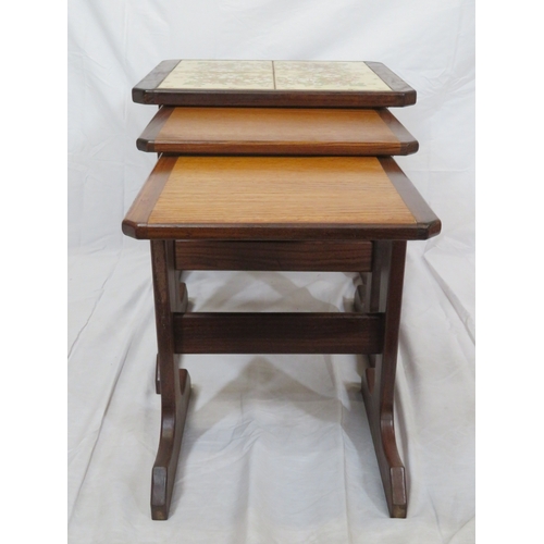114 - Nest of 3 G-plan tables, top one with tiled insets on oblong plinths