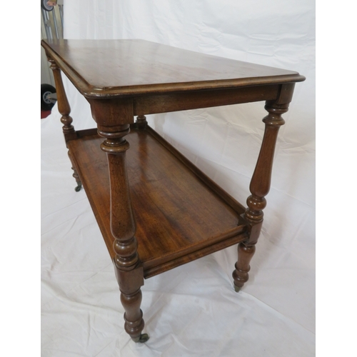 125 - Victorian mahogany 2-tier dumbwaiter with rounded corners, baluster turned columns, on castors