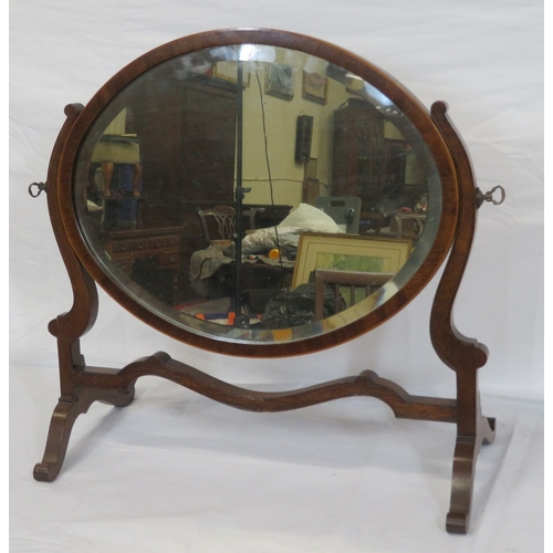 153 - Edwardian mahogany oval bevelled glass swivel mirror with shaped columns & stretcher, on bracket fee... 
