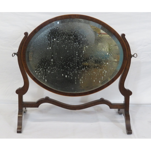 153 - Edwardian mahogany oval bevelled glass swivel mirror with shaped columns & stretcher, on bracket fee... 