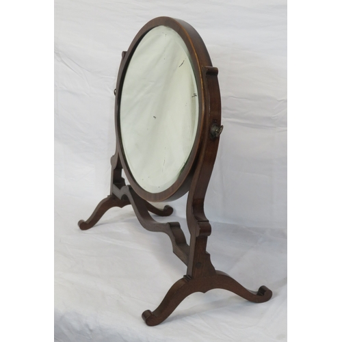 153 - Edwardian mahogany oval bevelled glass swivel mirror with shaped columns & stretcher, on bracket fee... 