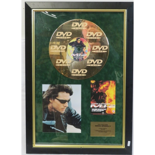 64 - Tom Cruise 'Mission Impossible II' DVD gold disc collection, framed with certificate from Our Price ... 