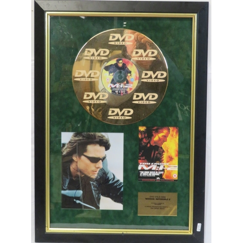 64 - Tom Cruise 'Mission Impossible II' DVD gold disc collection, framed with certificate from Our Price ... 