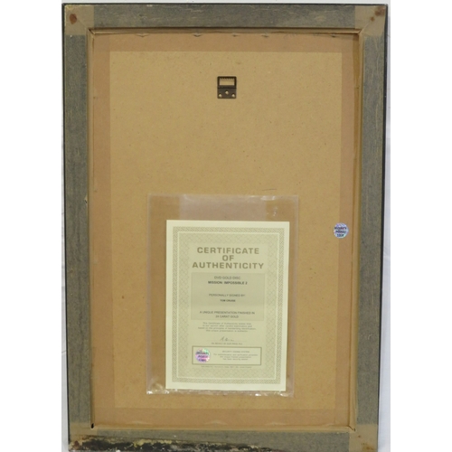 64 - Tom Cruise 'Mission Impossible II' DVD gold disc collection, framed with certificate from Our Price ... 