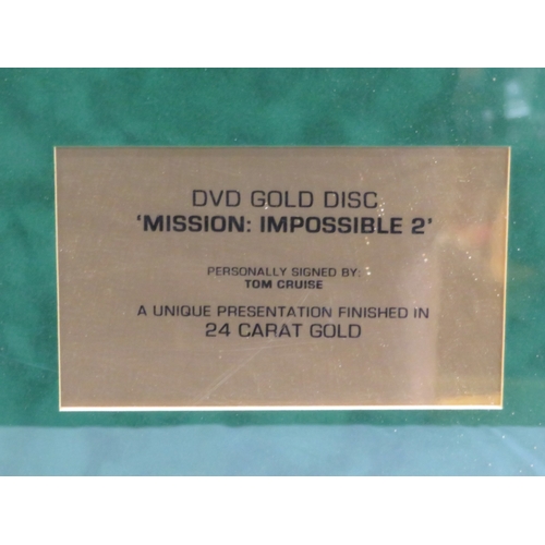 64 - Tom Cruise 'Mission Impossible II' DVD gold disc collection, framed with certificate from Our Price ... 