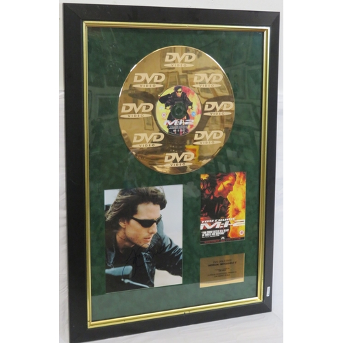 64 - Tom Cruise 'Mission Impossible II' DVD gold disc collection, framed with certificate from Our Price ... 
