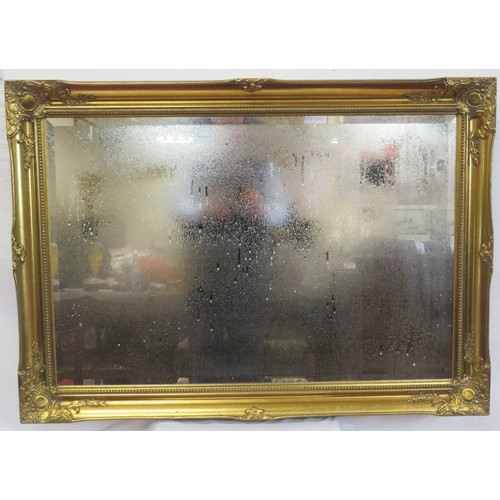147 - Ornate Regency design gilt framed bevelled glass wall mirror with foliate decoration 105cm x 75 cm