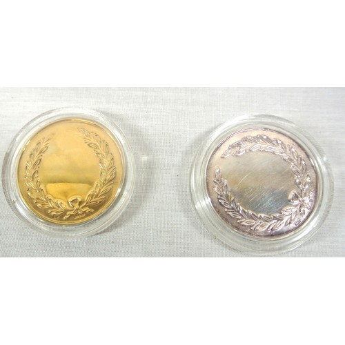 86 - Two commerative Monkstown Golf Club tokens /medals, one 9ct gold hall marked, one silver, in  black ... 