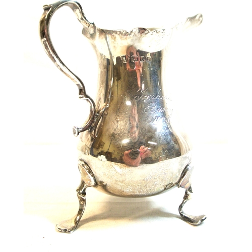 94 - London silver creamer of baluster form with wavy rim and handle, on 3 cast feet, 10cm, 111g