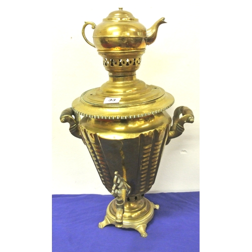 63 - Ornate Victorian style brass samovar with teapot on top, shaped handles and tap, on round base with ... 