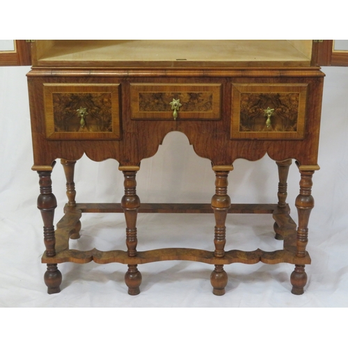70 - French design mahogany & walnut cabinet with serpentine top, glazed doors and shelved interior,3 inl... 