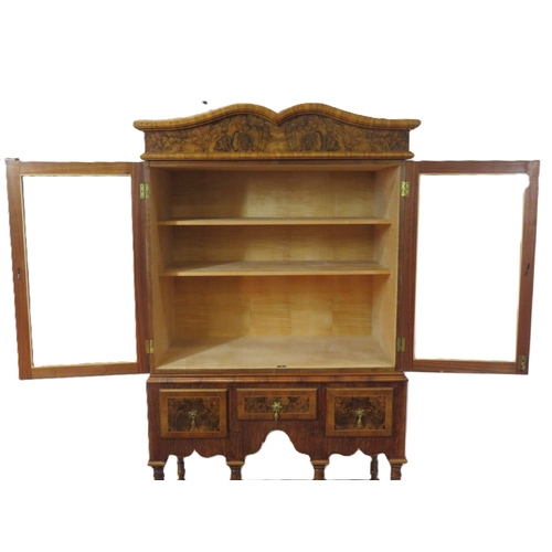 70 - French design mahogany & walnut cabinet with serpentine top, glazed doors and shelved interior,3 inl... 