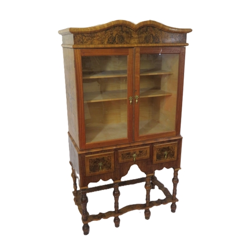 70 - French design mahogany & walnut cabinet with serpentine top, glazed doors and shelved interior,3 inl... 