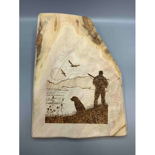 12 - 'Hunter with Dog', pyrography panel,, 35cm x 26cm