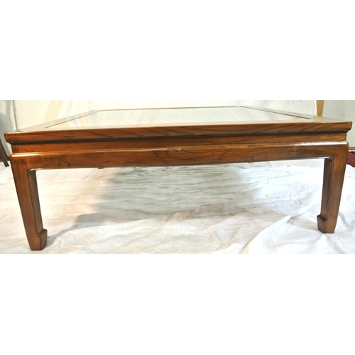 100 - Large square mahogany coffee or centre table with Chippendale style fretwork and glass top