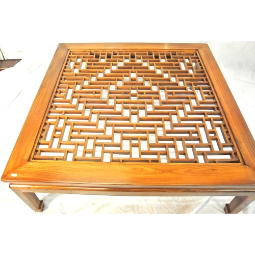100 - Large square mahogany coffee or centre table with Chippendale style fretwork and glass top