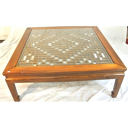 100 - Large square mahogany coffee or centre table with Chippendale style fretwork and glass top