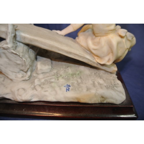 128 - Ornate Capodimonte group 'See-saw', with ornate foliate decoration