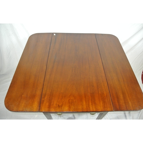 135 - Edwardian mahogany dropleaf table with rounded borders, pull-out supports, frieze drawer with brass ... 