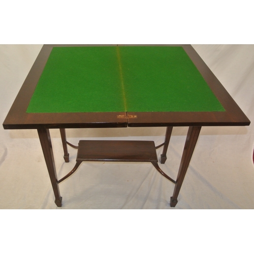 166 - Edwardian mahogany card table with fold-over swivel top, reeded & foliate decorated frieze, on reede... 