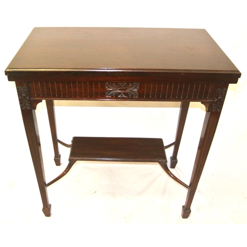 166 - Edwardian mahogany card table with fold-over swivel top, reeded & foliate decorated frieze, on reede... 