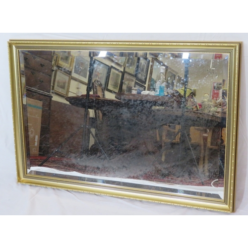 179 - Edwardian design gilt framed bevelled glass wall mirror with decorated frame