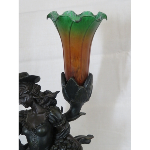 252 - Bronzed electric lamp with figure of an apple seller, on round base