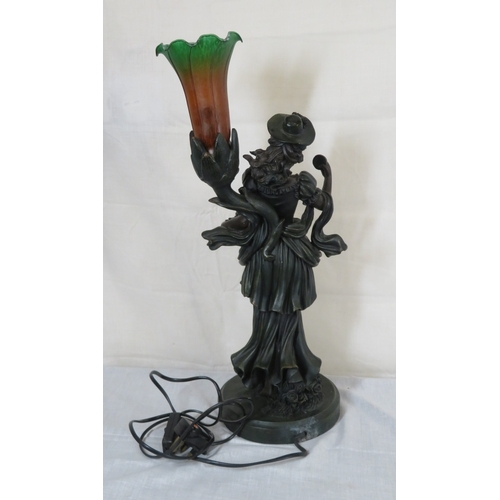252 - Bronzed electric lamp with figure of an apple seller, on round base