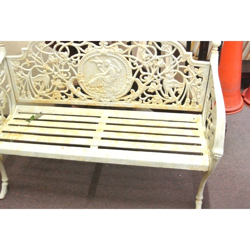 287 - Ornate cast iron garden bench with foliate, bird and figured decoration and shaped legs