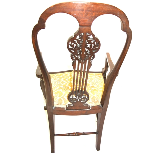 301 - Victorian mahogany open armchair with foliate carved pierces splat, shaped arms and seat, on cabriol... 