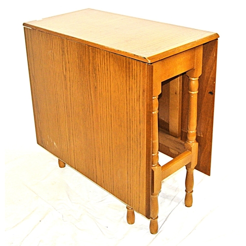 101 - Pine effect dining or kitchen table with drop leaves, gateleg support, with turned columns