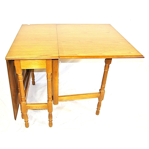 101 - Pine effect dining or kitchen table with drop leaves, gateleg support, with turned columns