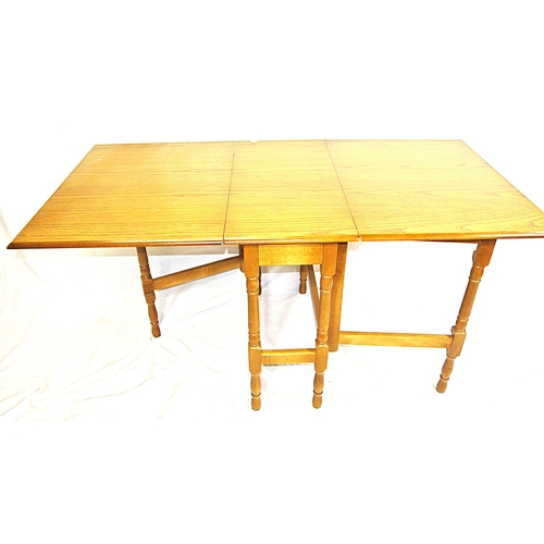 101 - Pine effect dining or kitchen table with drop leaves, gateleg support, with turned columns