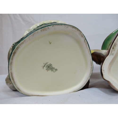 108 - 2 Royal Doulton and 2 Beswick toby jugs with shaped handles