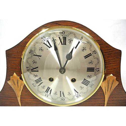 113 - Art Nouveau style domed mantle clock with brass framed silvered dial, on round feet
