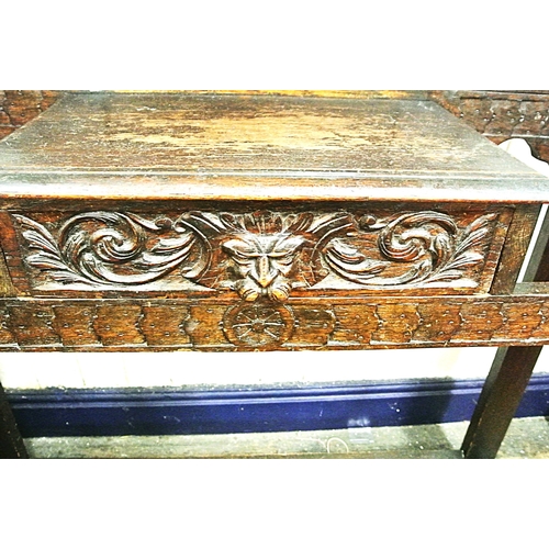 125 - Arts & Crafts oak hallstand with scroll and figured decoration, mirror inset, glove drawer, and turn... 