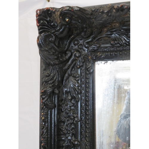 161 - Large black framed bevelled glass mirror with foliate and reeded decoration