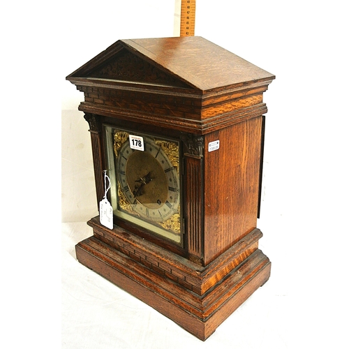 178 - Edwardian stye oak cased bracket clock with domed top, brass framed dial with ormolu mounts, on brac... 