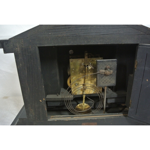 197 - French style mantle clock with angled top, round brass framed enamel dial, on bracket feet