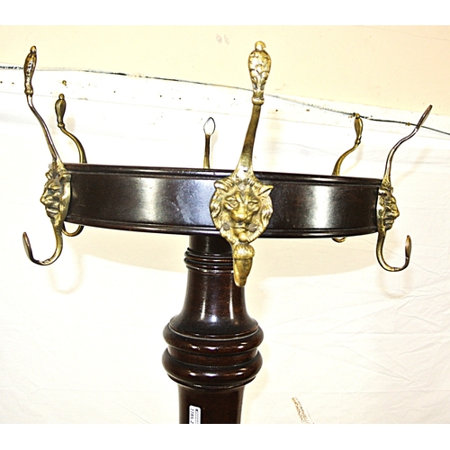 209 - Victorian mahogany round coat stand with lion mask hangers, twist reeded column, on hipped tripod wi... 