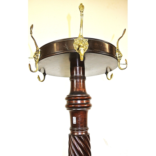 209 - Victorian mahogany round coat stand with lion mask hangers, twist reeded column, on hipped tripod wi... 