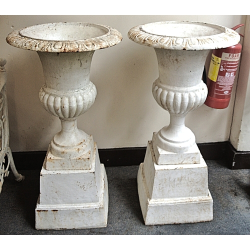 210 - Pair of Victorian design cast iron campana shaped garden vases with egg and dart rims, ribbed socles... 