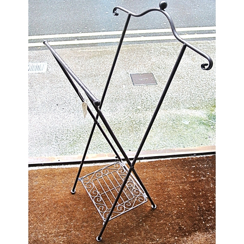 214 - Edwardian style wrought iron log rack with shaped arms