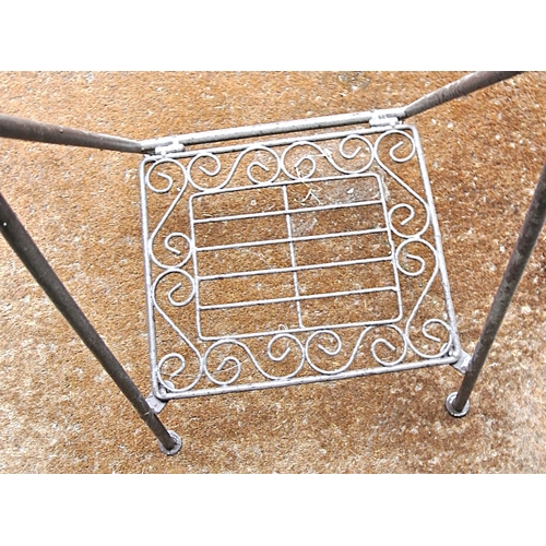 214 - Edwardian style wrought iron log rack with shaped arms