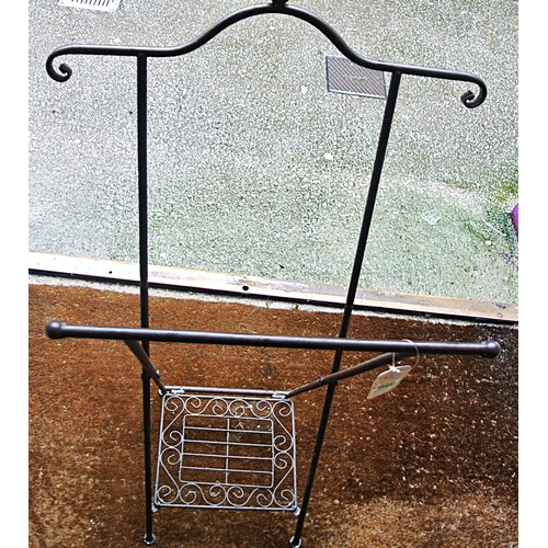 214 - Edwardian style wrought iron log rack with shaped arms