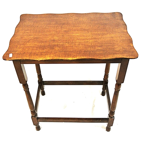 79 - Edwardian mahogany occasional table with wavy rims and turned columns